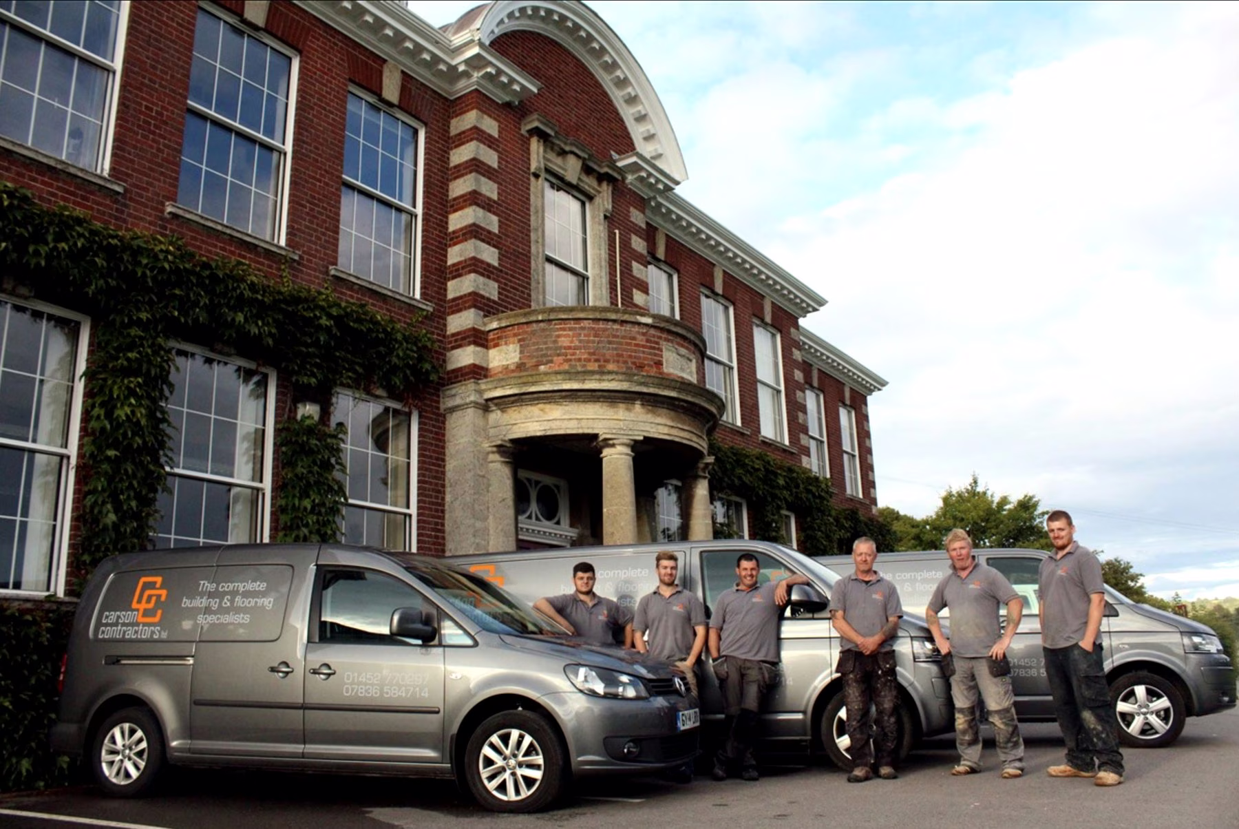 The reliable Carson Contractors team with branded work vehicles